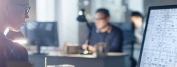 Engineer looking at drawling on computer