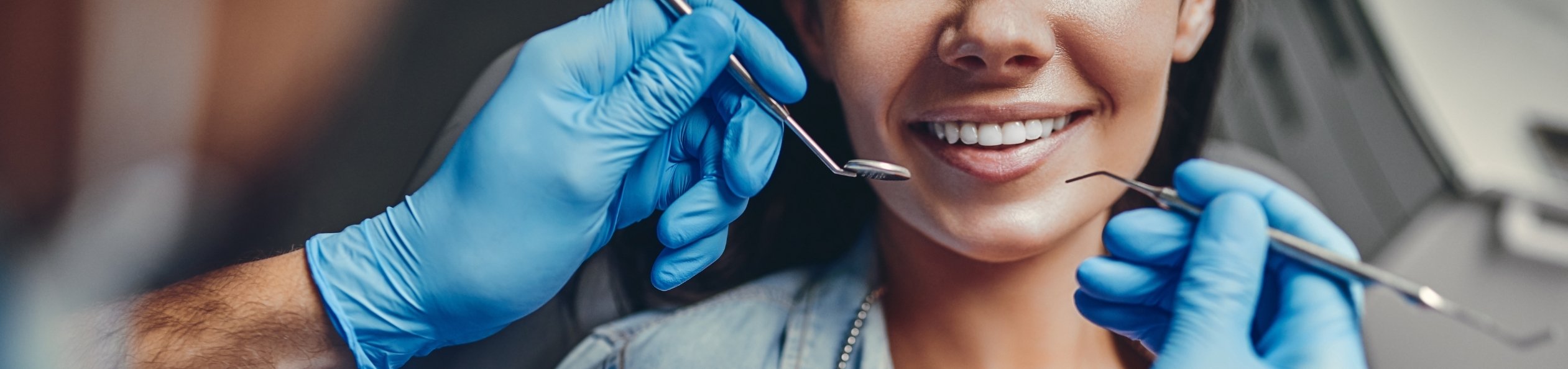 Photo of a dentist working on a patients teeth