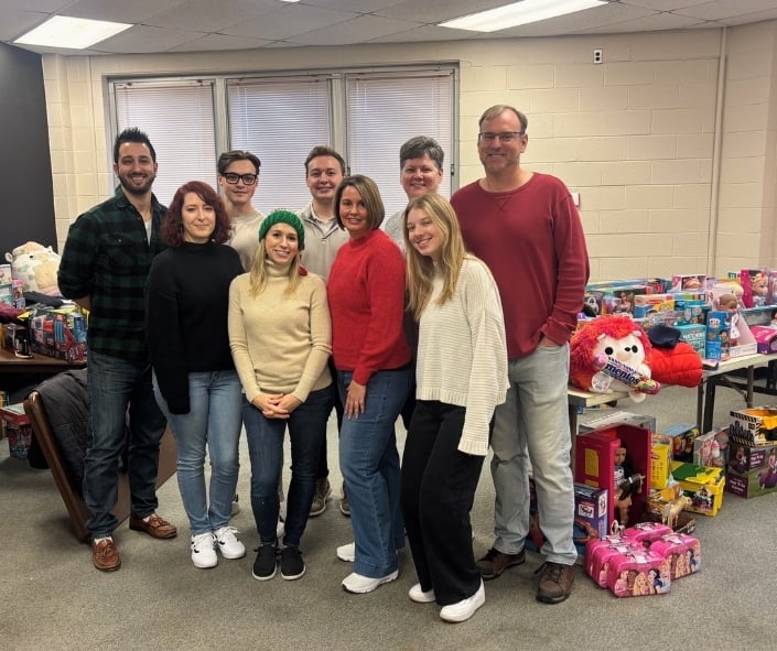 group photo of professionals volunteering at the Loft