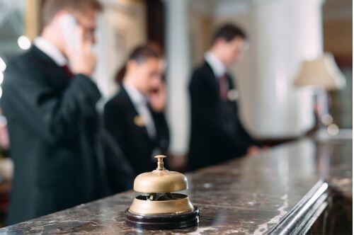 image of hotel front desk with bell