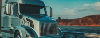photo of a semi-truck on the road