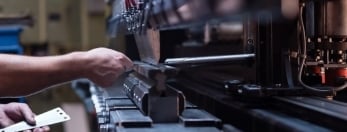 photo of someone working at a manufacturing plant