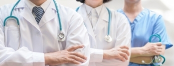photo of two doctors and another healthcare professional