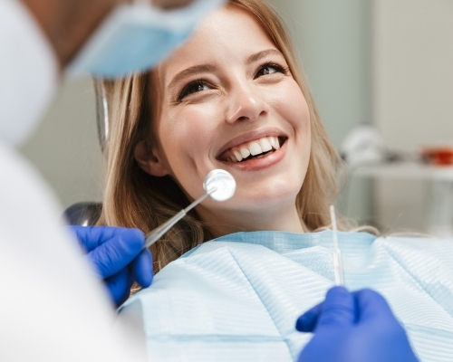 woman smiling at the dentist
